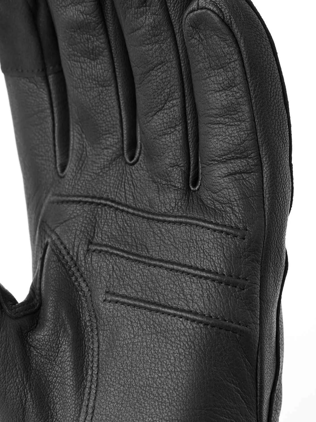 Detailaufnahme einer schwarzen Lederhandschuhinnenfläche mit sichtbaren Fingerzwischenräumen und Nähten.