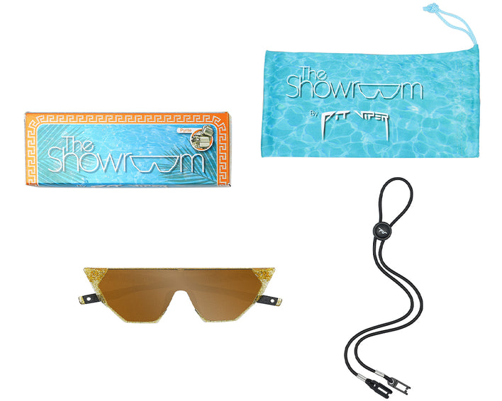 Produktbild: The Showroom Pyrite Sonnenbrille mit Brillenband, Etui und Verpackung.