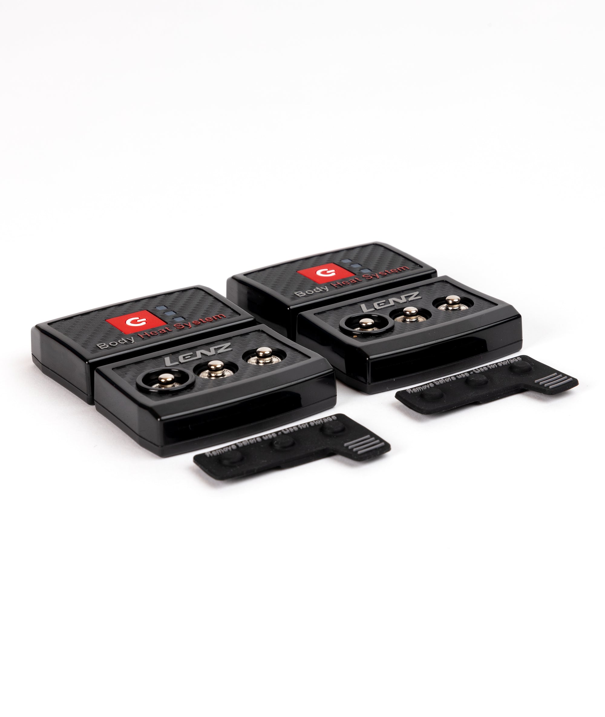 Zwei schwarze Lenz Body Heat System Controller mit zwei Abdeckungen auf weißem Grund.