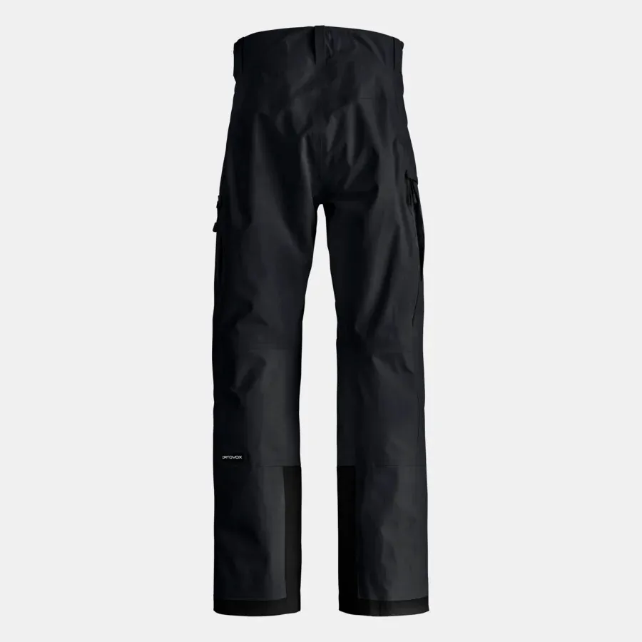 Schwarze, lange Hose mit hoher Taille und aufgesetzten Taschen. Die Hosenbeine sind am unteren Ende verstärkt.