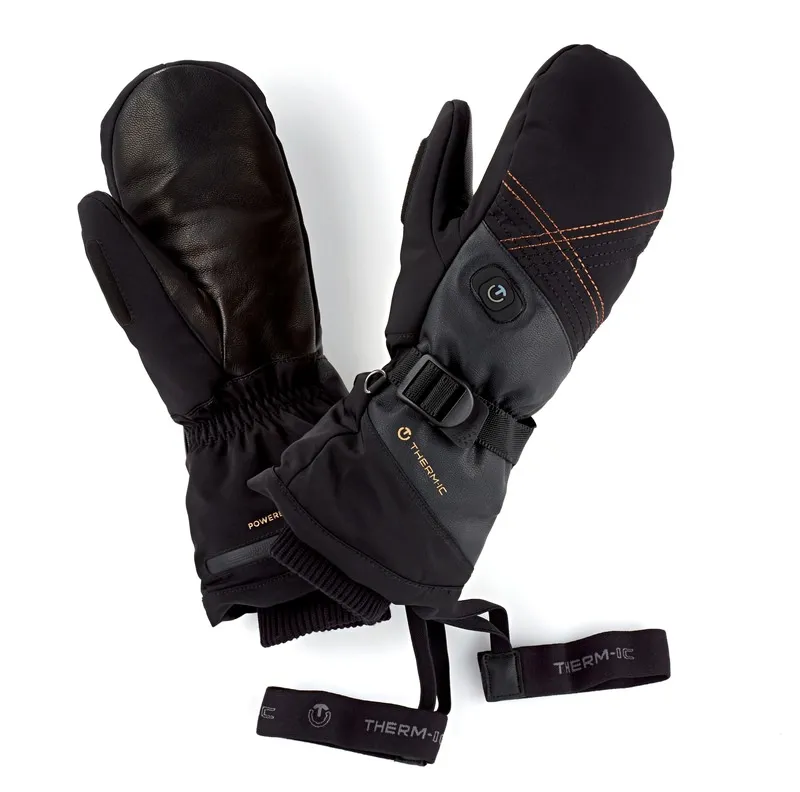 Schwarze Therm-ic Ultra Heat Fäustlinge für Damen mit Lederdetails und Handgelenkschlaufen auf weißem Grund.