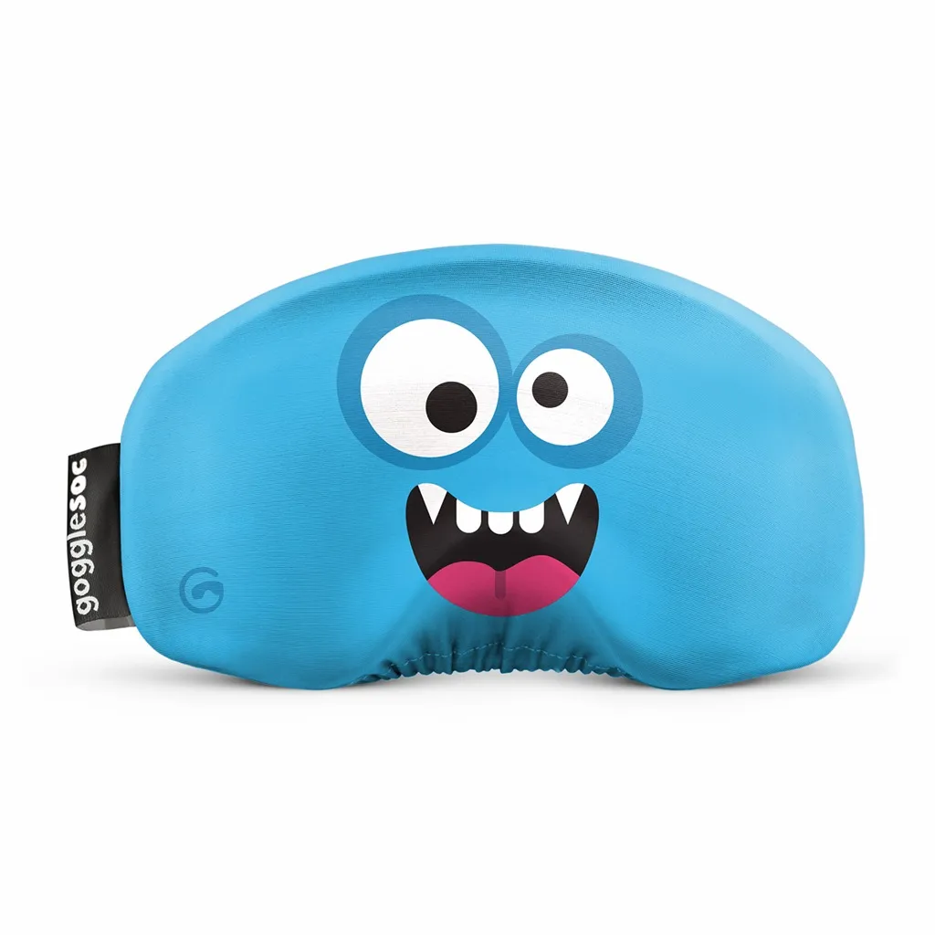 Blauer Monster Soc für Skibrille mit aufgedrucktem Gesicht mit großen Augen und Zähnen. Schwarzes Etikett mit weißem Schriftzug.