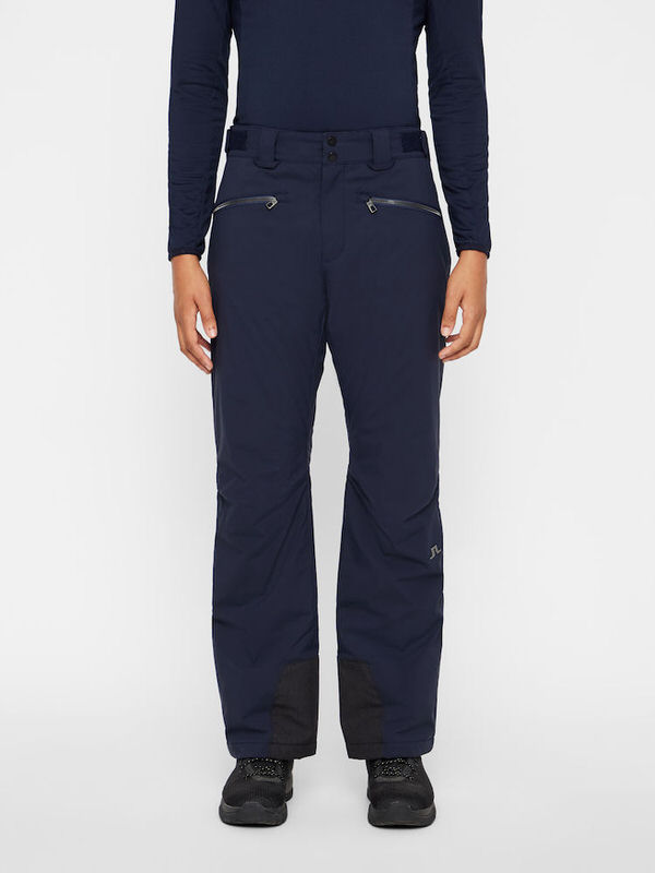 J.Lindeberg Marineblaue Skihose Marineblaue J.Lindeberg Truuli Skihose für Herren, frontal getragen, mit Reissverschlusstaschen und verstärktem Beinabschluss.