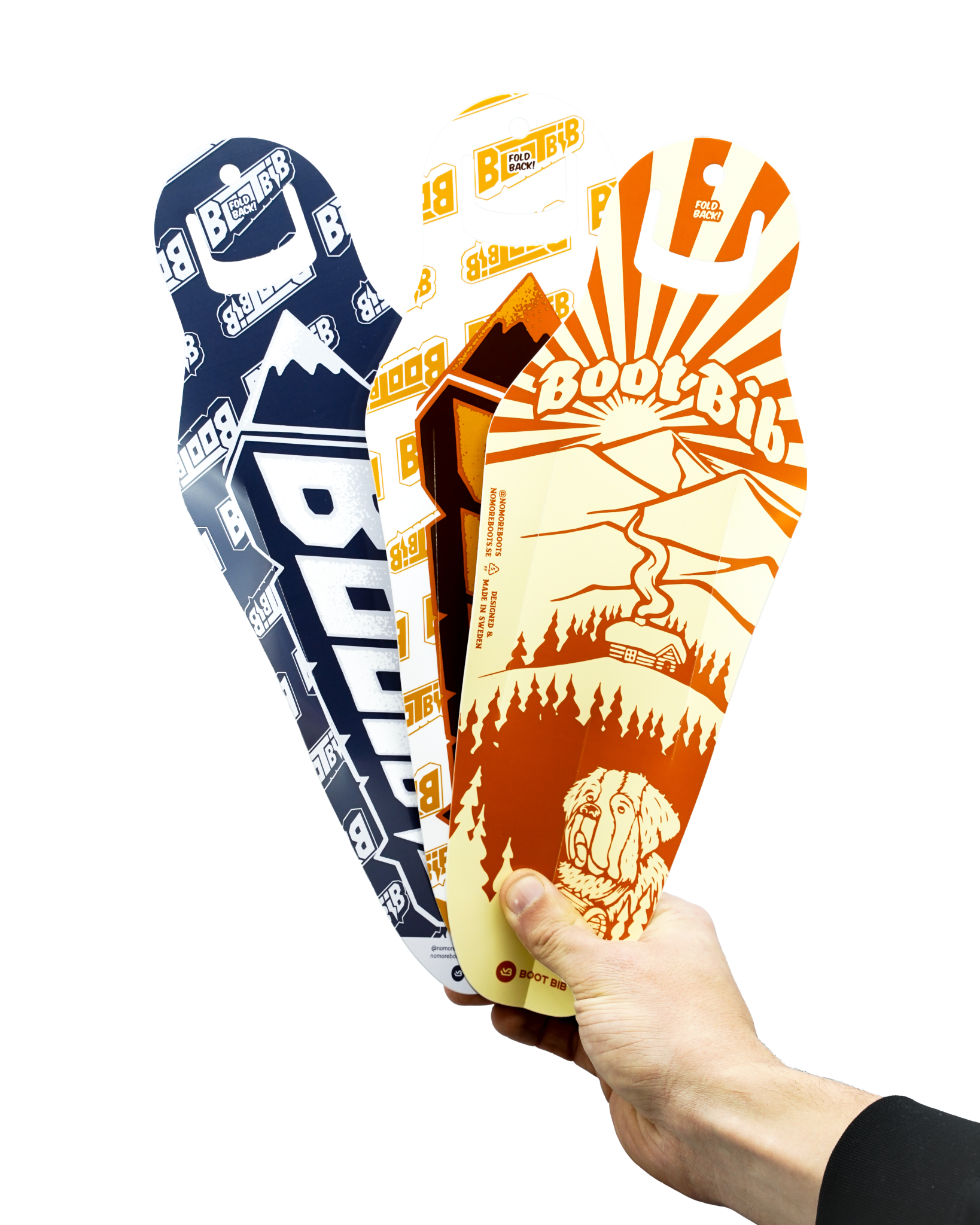 Eine Hand hält drei farbige Boot Bib Schuhlöffel mit verschiedenen Wintermotiven.