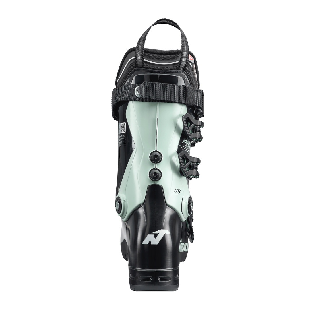 Rückansicht des Nordica Pro Machine 115 Women Skischuhs in Schwarz und Mintgrün mit Schnallen und Trageschlaufe.