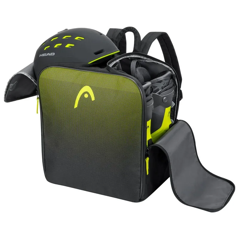 Offener, schwarzer Head Skischuh Rucksack mit Helm und Skischuhen. Gelbes Head Logo und Akzente.
