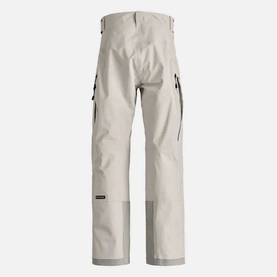 Helle, lange Skihose mit Hosenträgern und aufgesetzten Taschen vor neutralem Hintergrund.