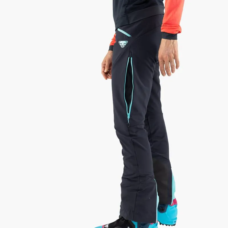 Detailansicht der Dynafit TLT Touring DST Women Hose in Blau, seitlicher Reißverschluss und Logo sichtbar.