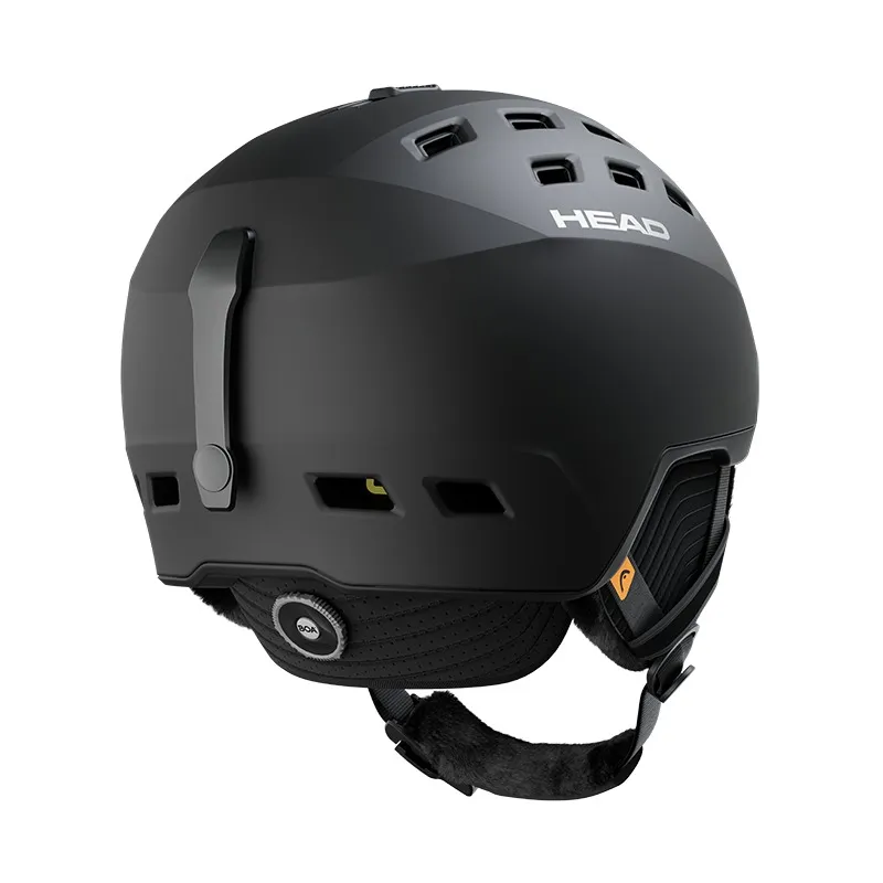Schwarzer Head REV Mips Skihelm von hinten, mit Ohrenschützern und Einstellrad.