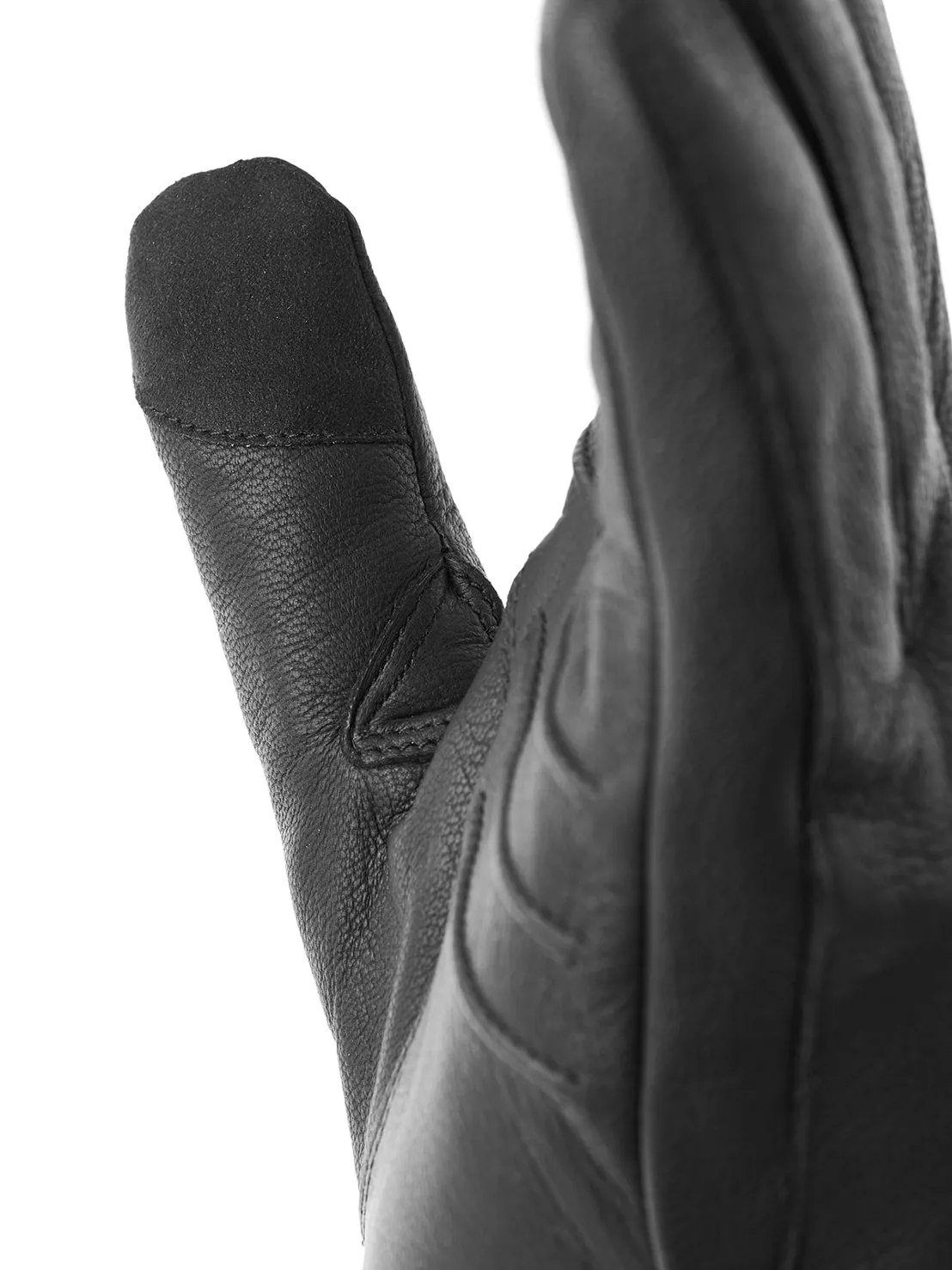 Detailaufnahme eines schwarzen Lederhandschuhs, der einen Daumen und Teile anderer Finger zeigt.