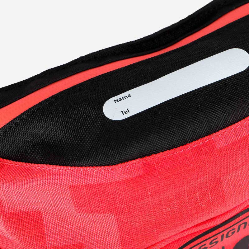 Detailaufnahme der Rossignol Nordic Thermo Belt in Rot mit Namensetikett.