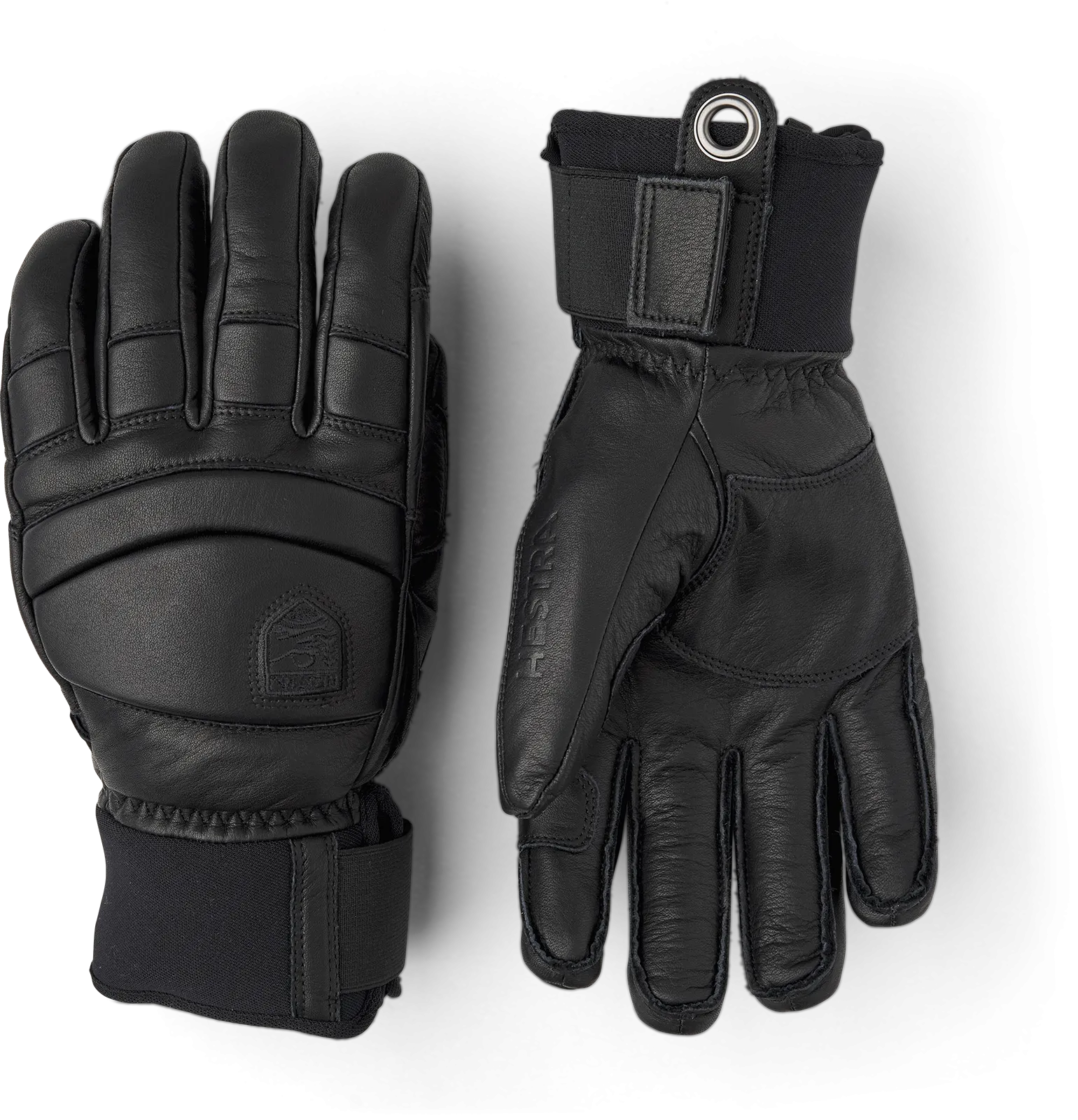 Zwei schwarze Hestra Fall Line Lederhandschuhe liegen auf einem weißen Hintergrund.