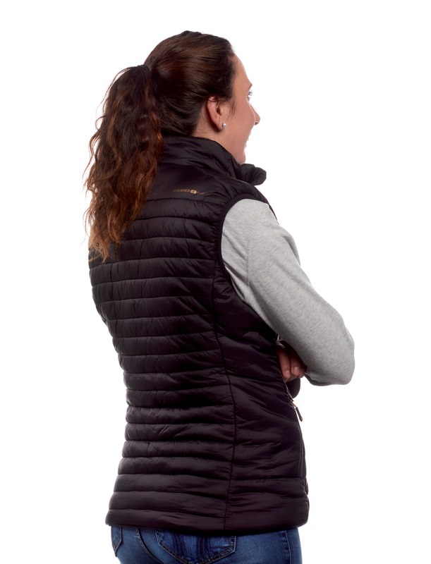 Damen Heizweste Rückansicht Damen Therm-ic Heizweste, Rückansicht: Eine Frau trägt die schwarze, ärmellose Daunenweste über einem grauen Pullover.