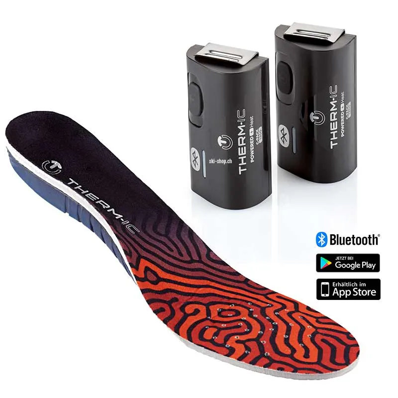 Therm-ic Insole Heat 3D Sohle mit Akkus. Die Sohle ist schwarz-rot gemustert. Die Akkus sind schwarz und haben einen silbernen Clip.