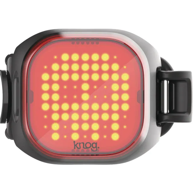 Schwarzes Mini Rücklicht in Schädelform mit gelben LEDs und roter Hintergrundbeleuchtung.