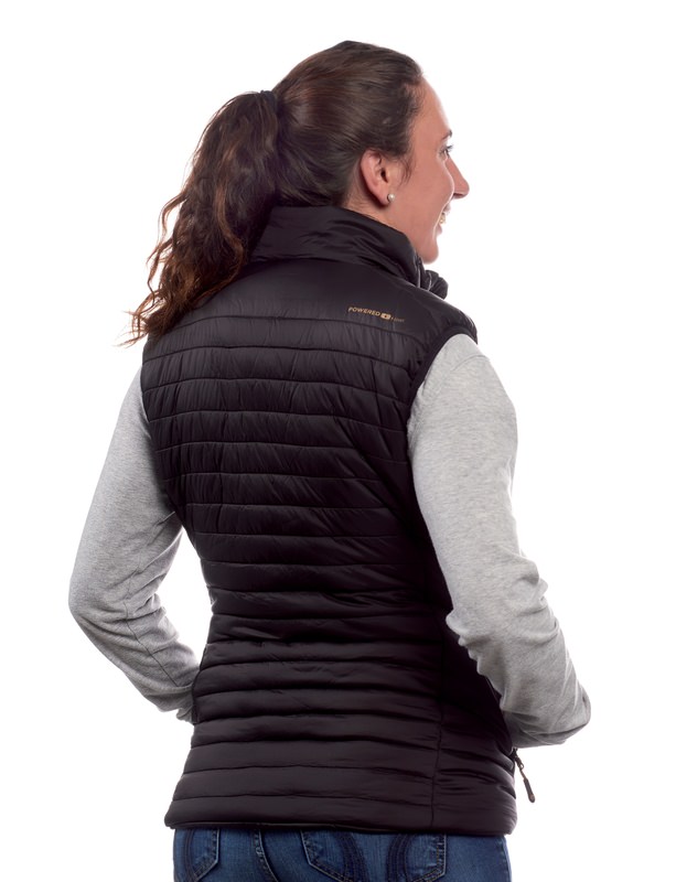 Thermo-Weste Damen schwarz Rückansicht einer Frau mit Therm-ic Heated Vest Women, gesteppt, schwarz, mit Kragen und seitlichen Reißverschlüssen.