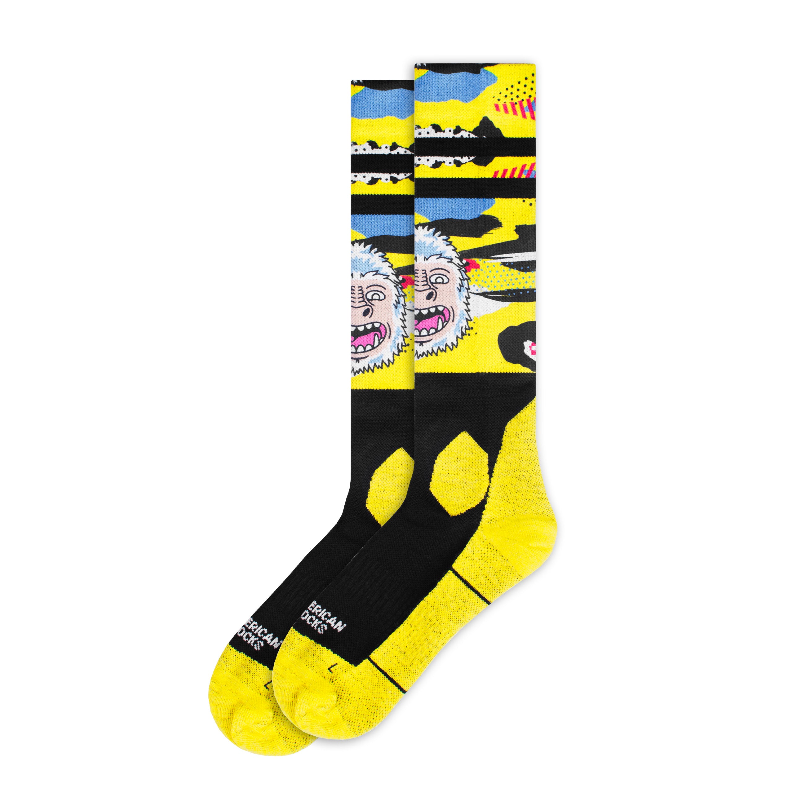 Gelbe, knielange Snow Socks mit Yeti-Motiv, schwarzem Fußteil und Bündchen.