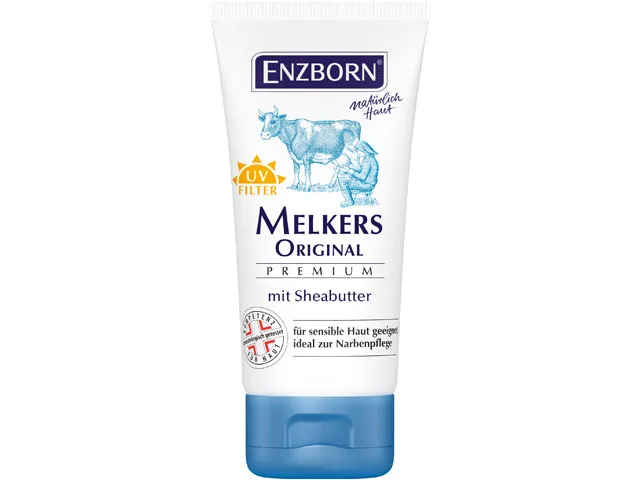 Weiße Tube Enzborn Melkers Original Premium Sheabutter mit Kuh- und Melker-Illustration. UV-Filter und Text.