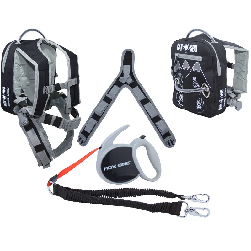Snowboard-Lernhilfe-Set für Kinder in Schwarz/Grau: Kinder-Harness mit Rucksackfunktion, verstellbaren Gurten und Haltegriff; längenverstellbare Leine mit Karabiner; separate Handrolle zum Einziehen für mehr Kontrolle.