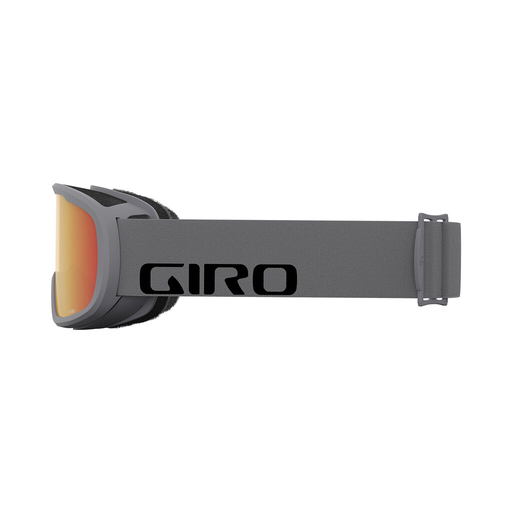 Graue Giro Roam Schneebrille mit orangefarbener Scheibe, seitliche Ansicht, Markenlogo auf dem Band.