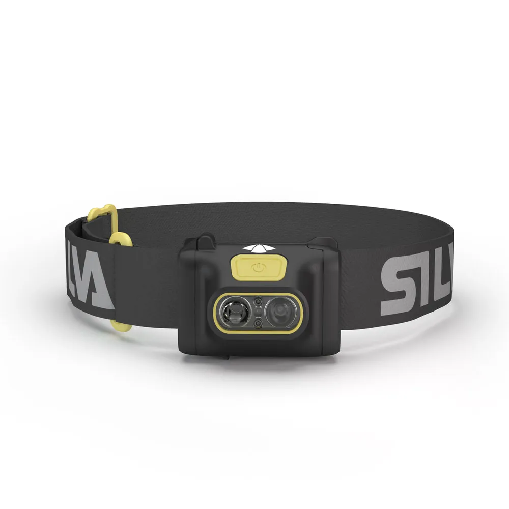 Schwarze Stirnlampe Scout 3 mit gelben Akzenten und verstellbarem, beschriftetem Kopfband vor hellem Hintergrund.