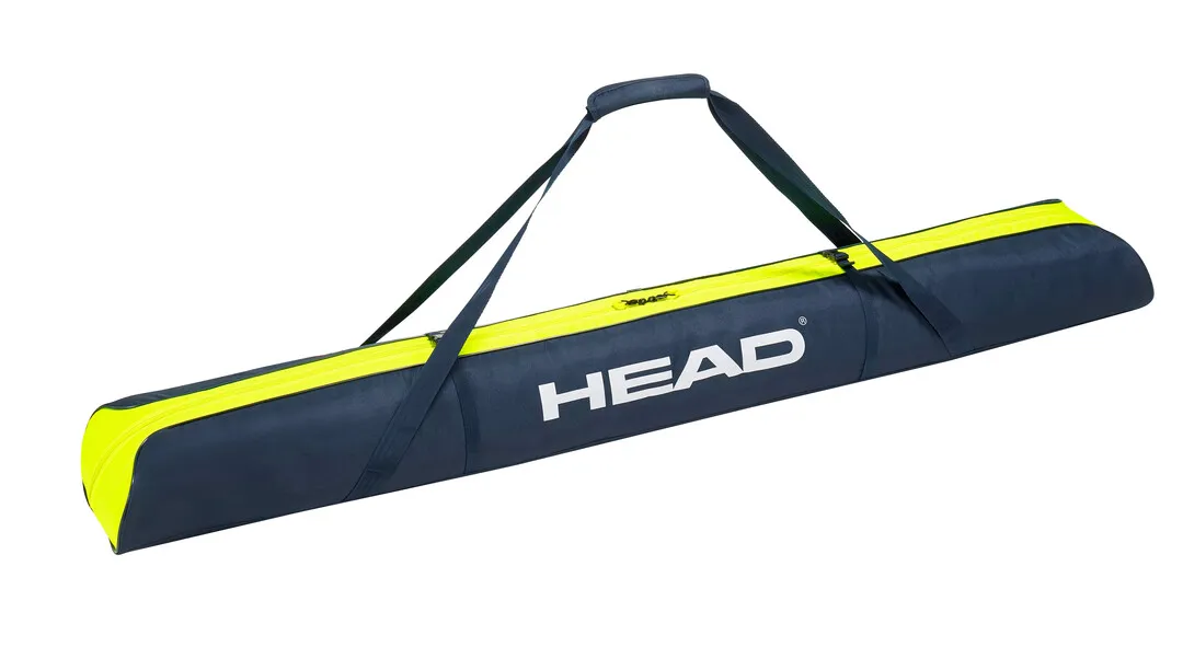 Skibag, dunkelblau mit gelben Akzenten, Tragegriff und "HEAD" Logo.