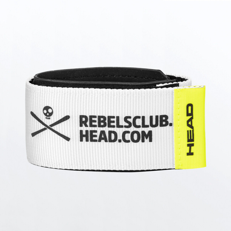 Aufgerolltes, weißes Head Rebels Skifix mit gelbem Head-Logo und Totenkopf-Motiv.