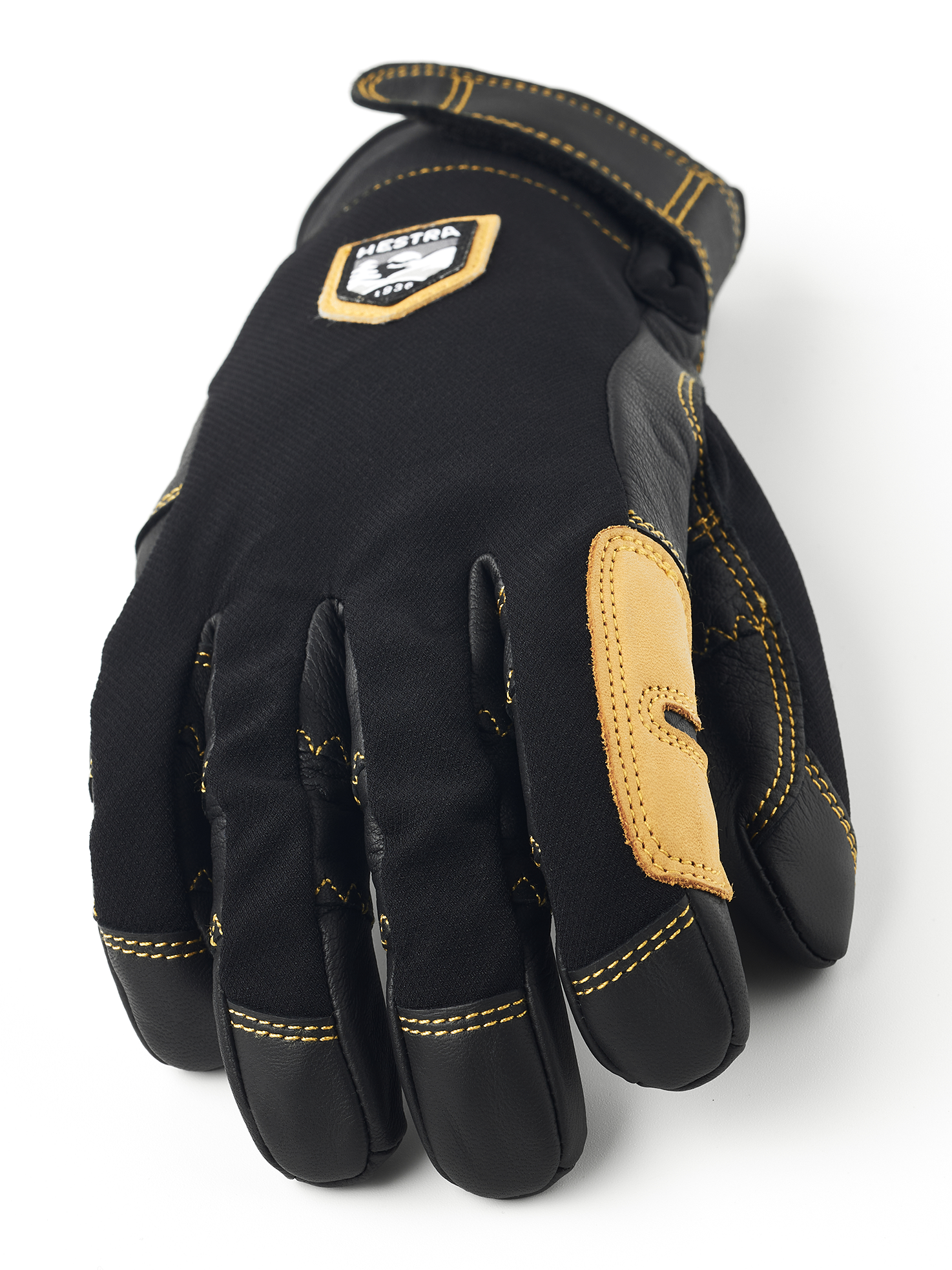Schwarzer Hestra Handschuh Detailansicht des schwarzen Hestra Ergo Grip Active Handschuhs mit gelben Nähten.
