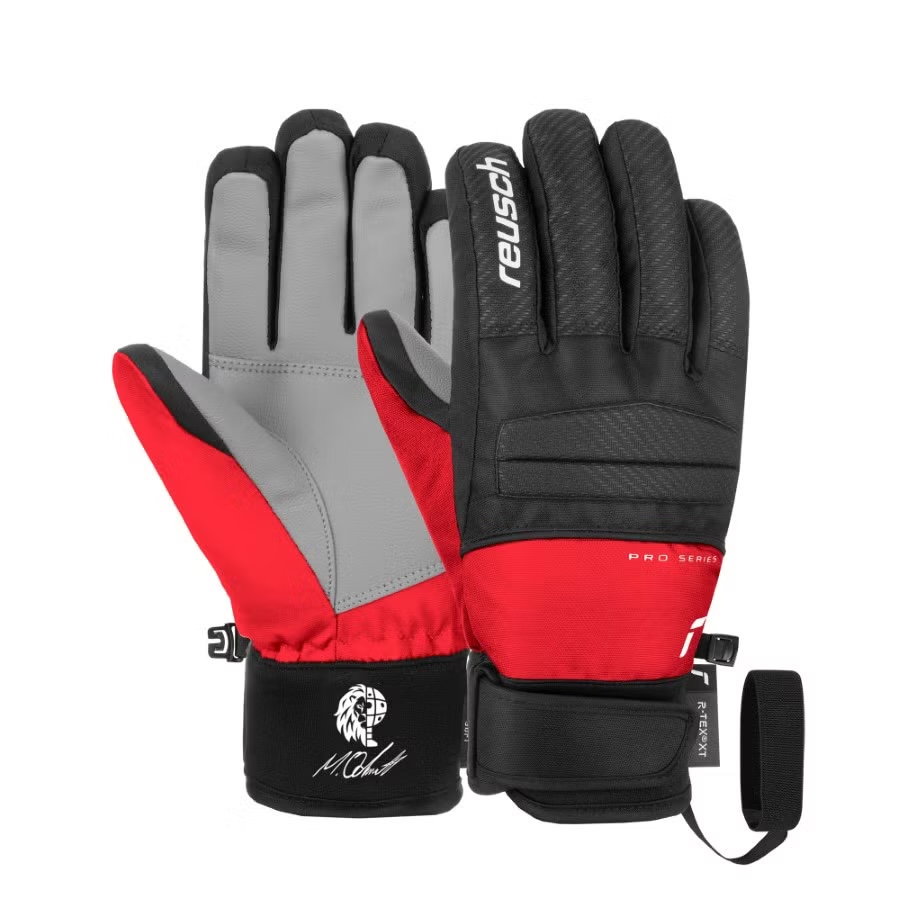 Zwei Reusch Warrior R-TEX XT Junior Skihandschuhe in Rot, Schwarz und Grau.