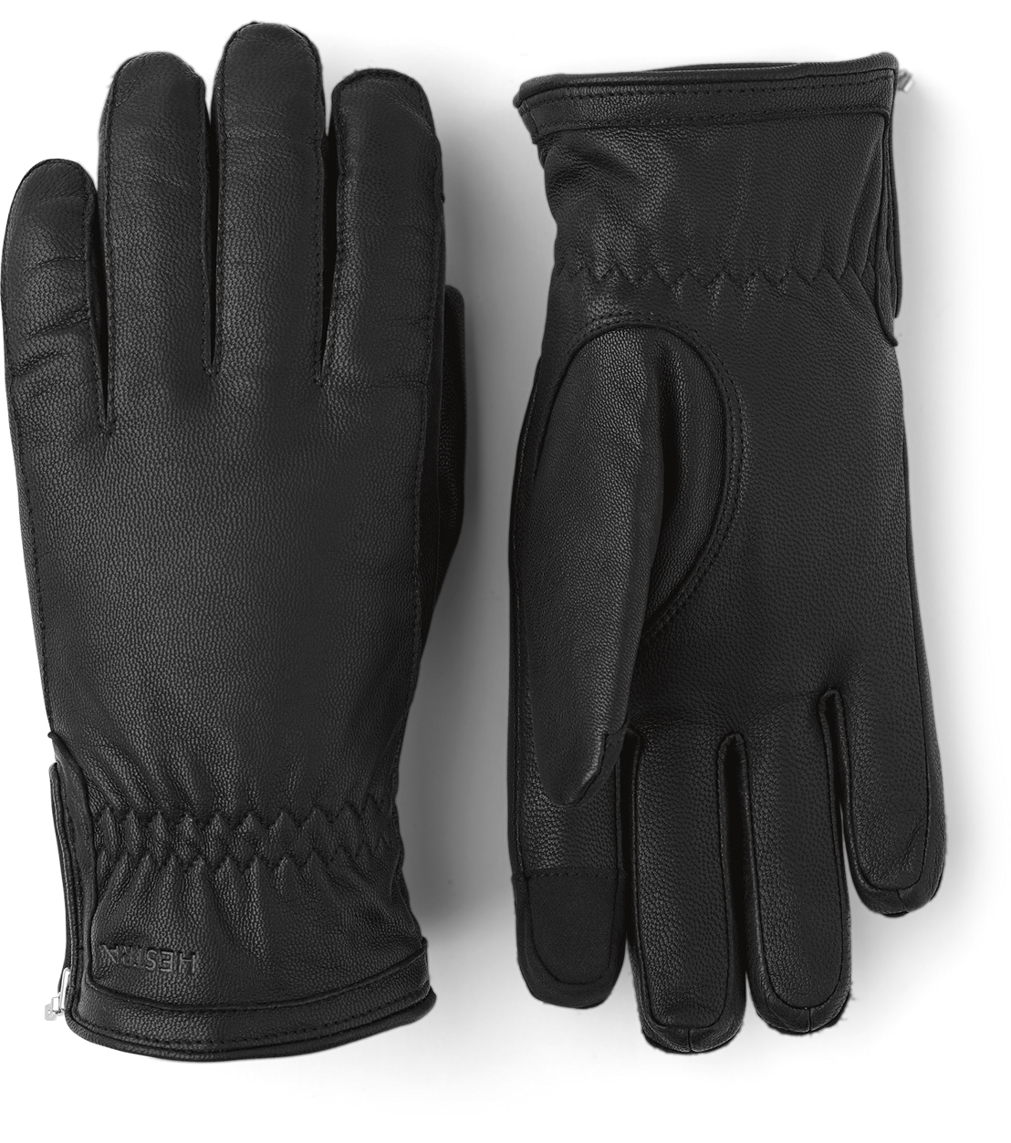 Schwarze Lederhandschuhe Zwei schwarze Lederhandschuhe, einer mit der Handfläche nach oben und einer mit dem Handrücken.