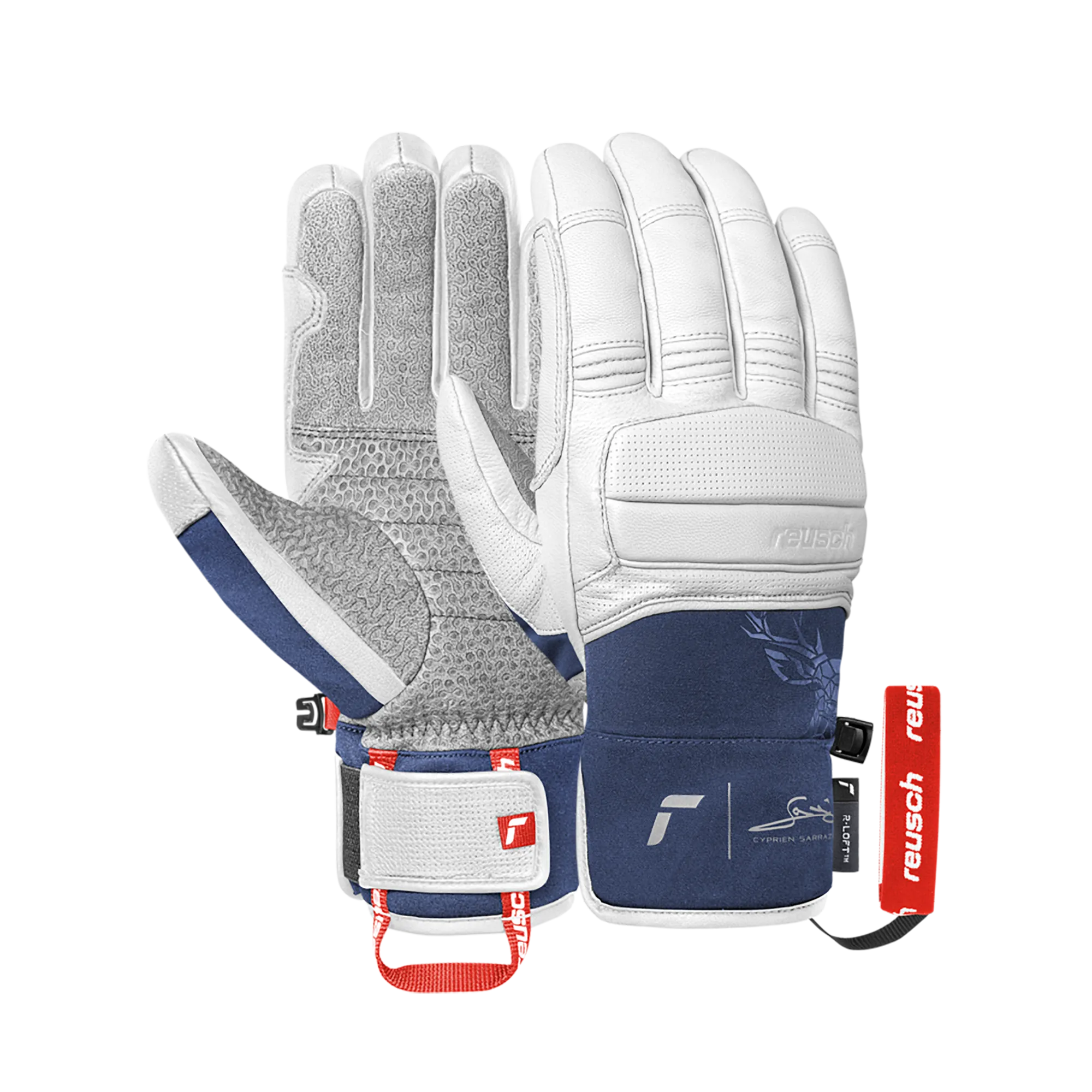Zwei Ski-Handschuhe von Reusch, weißes Leder mit dunkelblauen Akzenten und floralem Muster, liegen vor einem weißen Hintergrund.