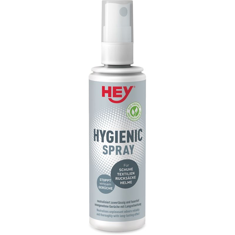 Weißer Sprühflasche "HEY Hygienic Spray" mit Text und Logos auf grauem Hintergrund. Geeignet für Schuhe, Textilien, Rucksäcke und Helme.