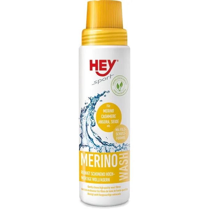 Weiße Flasche Hey Sport Merino Wash mit gelbem Deckel und Text für feine Wollfasern.