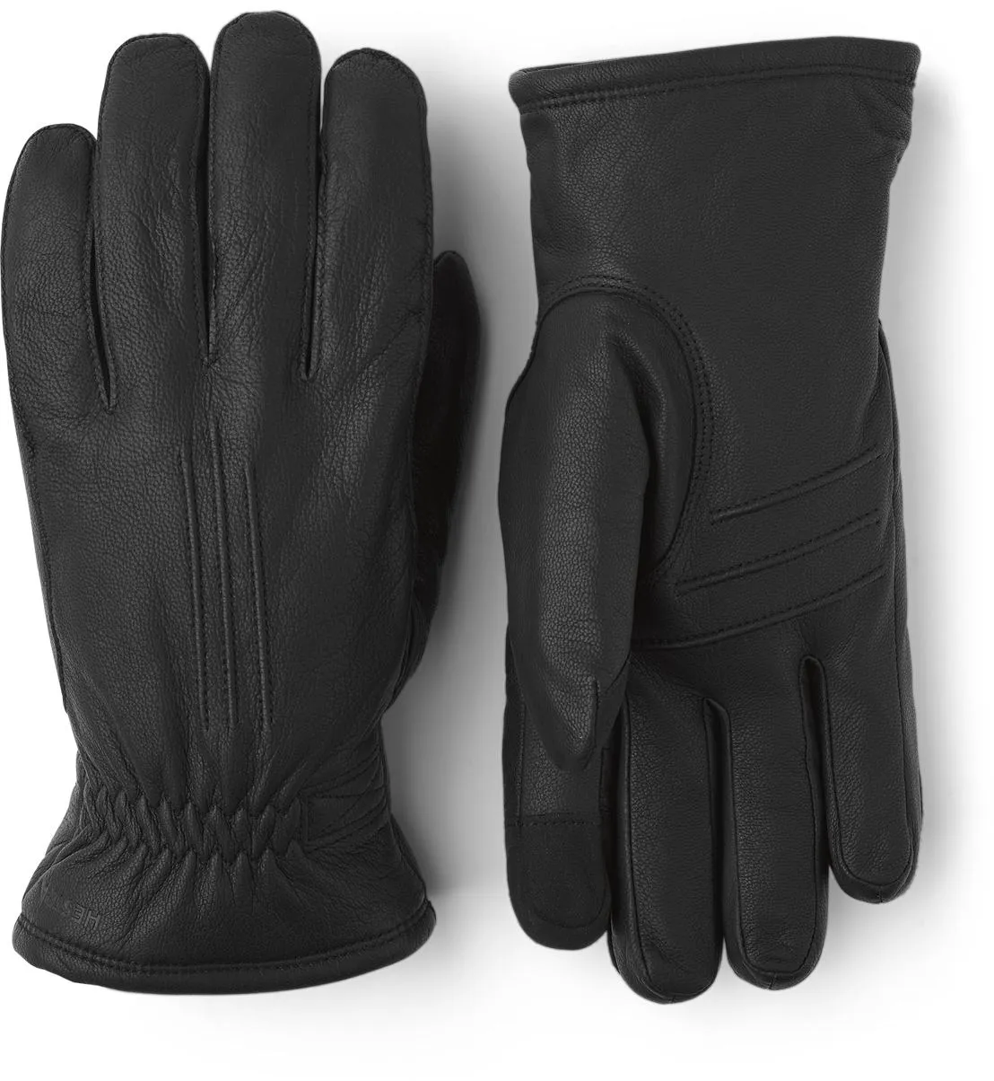 Zwei schwarze Lederhandschuhe liegen nebeneinander, einer mit der Handfläche nach oben, der andere mit dem Handrücken nach oben.