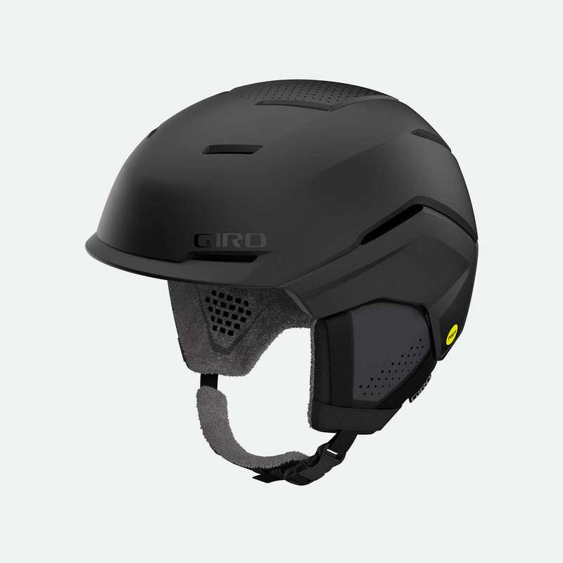 Mattschwarzer Giro Tenet MIPS Women Skihelm, seitliche Ansicht mit Ohrenpolstern und Kinnriemen.