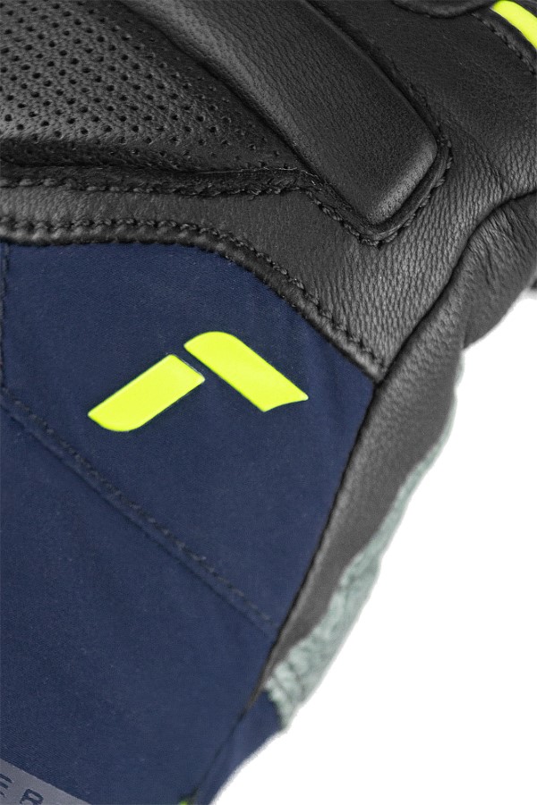 Reusch Marco Odermatt Handschuh Detailansicht des Reusch Marco Odermatt WC Handschuhs: Schwarzes Leder, dunkelblaues Softshell, fluo-lime Logo.