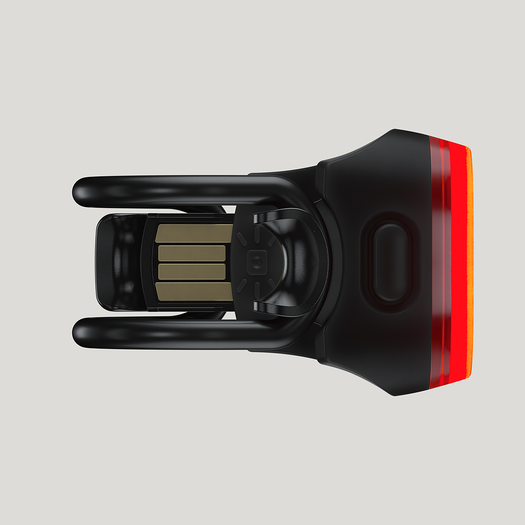 Schwarzes Blinder Mini Skull Rücklicht mit USB-Anschluss und roter LED-Beleuchtung, Nahaufnahme.