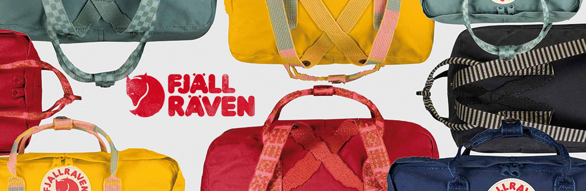 fjallraven-rucksack-kanken-kaufen-banner Nahaufnahme von Fjällräven Kånken Rucksäcken in diversen Farben, mit Logo im Zentrum.