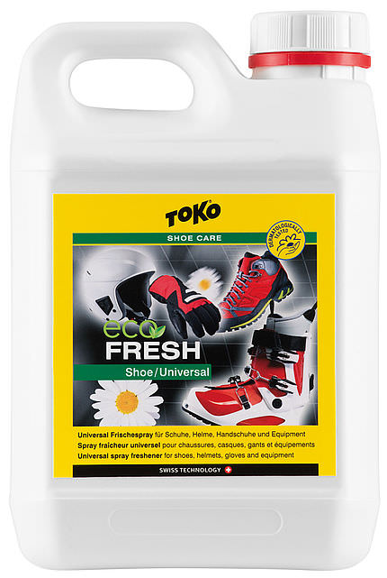 Toko Eco Shoefresh Weißer Kanister Toko Eco Shoefresh mit gelbem Etikett. Abbildung von Schuhen, Helm, Handschuhen und Bergstiefel auf dem Etikett.