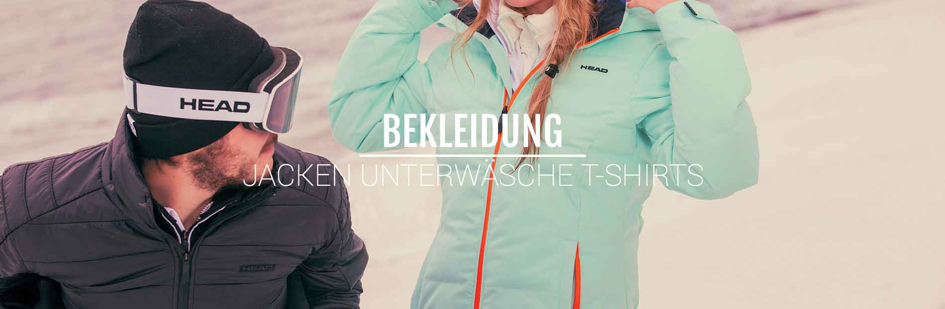 Zwei Personen in Winterkleidung. Eine in einer schwarzen Jacke mit Mütze und Skibrille, die andere in einer hellgrünen Jacke.